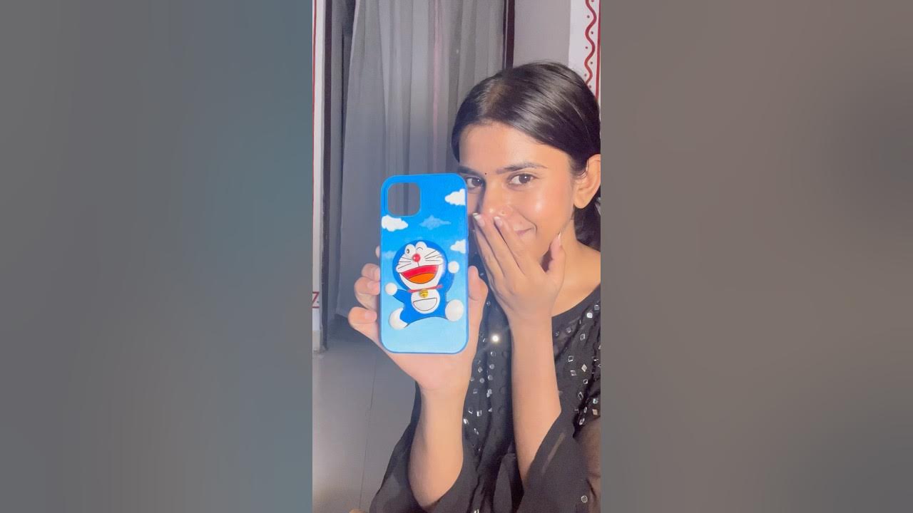 YouTube post by @iVasuu for Swiss Beauty Cosmetic. Caption reads: I made doraemon on my phone cover @iVasuu....