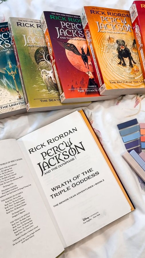 Instagram post by @readbytiffany for Read Riordan. Caption reads: what book are you excited to read next? 💙 #ad

i....