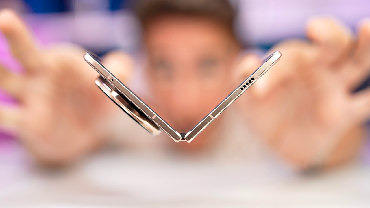 YouTube post by @TheiCollection for IPLN. Caption reads: Okay, I found the perfect folding smartphone!....