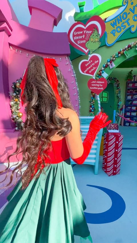 Instagram post by @krystaleverdeen for Universal Studios Hollywood. Caption reads: [...] outfit for Grinchmas at Universal Studios....