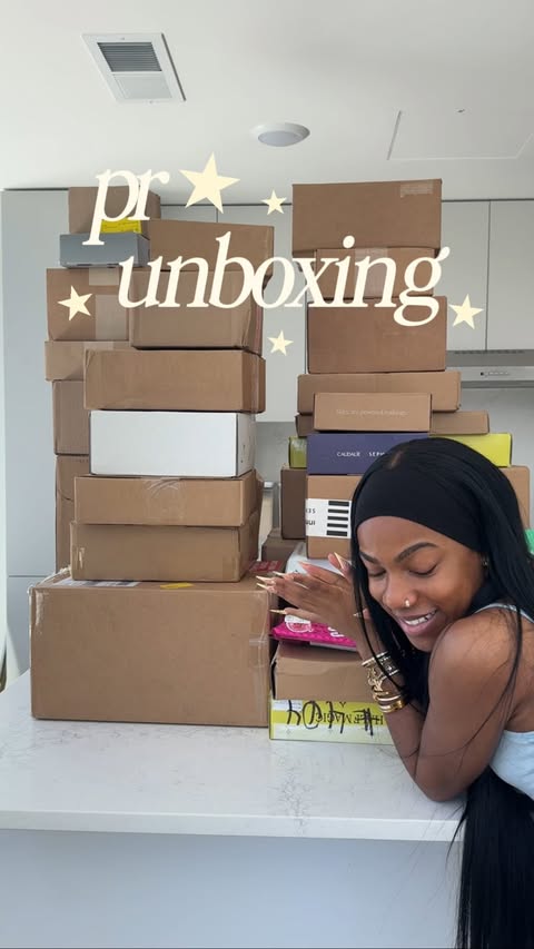Instagram post by @queen.olu for Viktor&Rolf Fragrances. Caption reads: first pr unboxing in my new place! 🤭 huge thank....