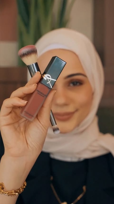 Instagram post by @dr.daliakokash for Saint Laurent. Caption reads: Feminine energy in a shade💕— Yves Saint Laurent....