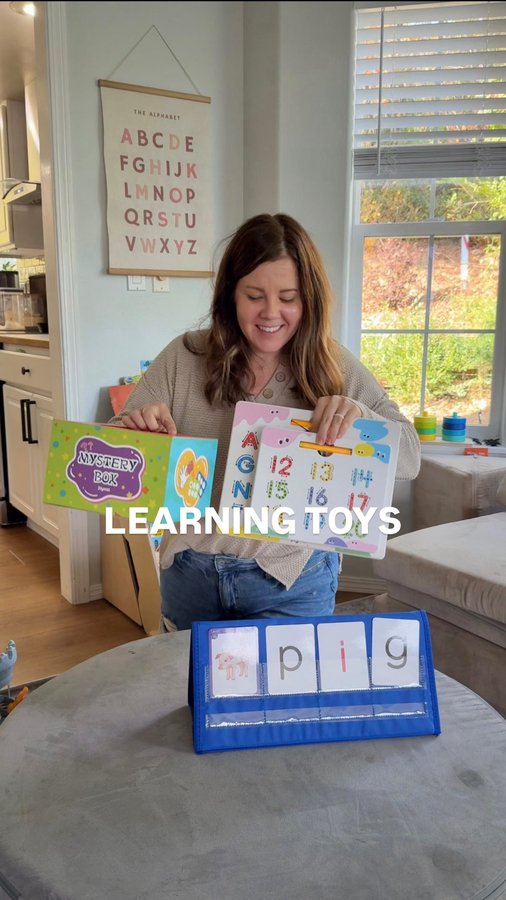 Instagram post by @pineconesandpacifiers for JoyCat. Caption reads: [...] so easy with these learning toys from....