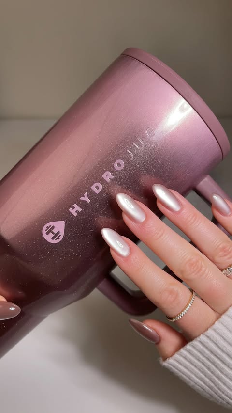 Instagram post by @katiesnails_ for HYDROJUG. Caption reads: GIVEAWAY CLOSED 🩵🎀🤎 Our Cateye HydroJugs sold....