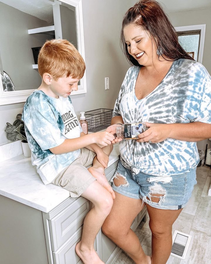 Instagram post by @raisingredmom for Airborne. Caption reads: #airbornepartner Summer break flashed before our....