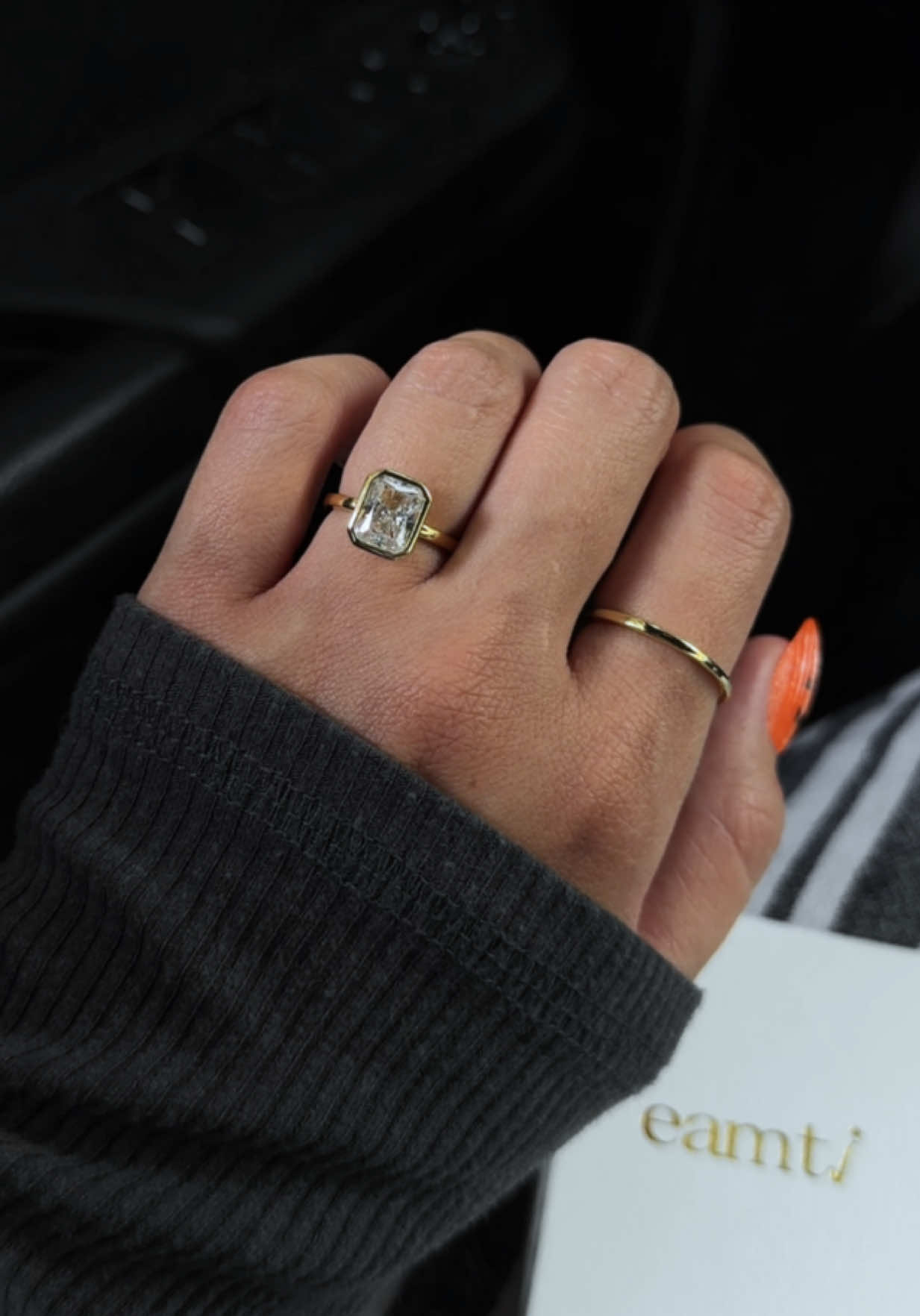 TikTok post by @leahfrzr for EAMTI Jewelry. Caption reads: [...] #engagementring #promisering @EAMTI Jewelry.