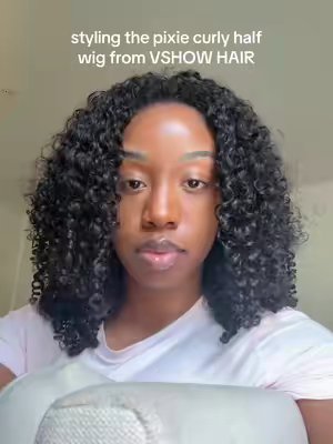 TikTok post by @malayakarael for Vshow Hair. Caption reads: [...] to get my hands on pixie curly @VSHOW HAIR....