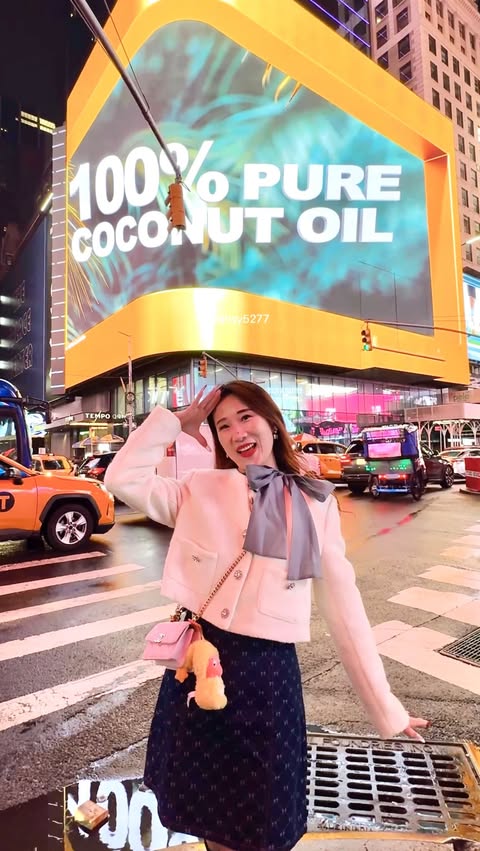 Instagram post by @food_drinks_travels for Parachute Advansed. Caption reads: Among a million lights at Times Square this....