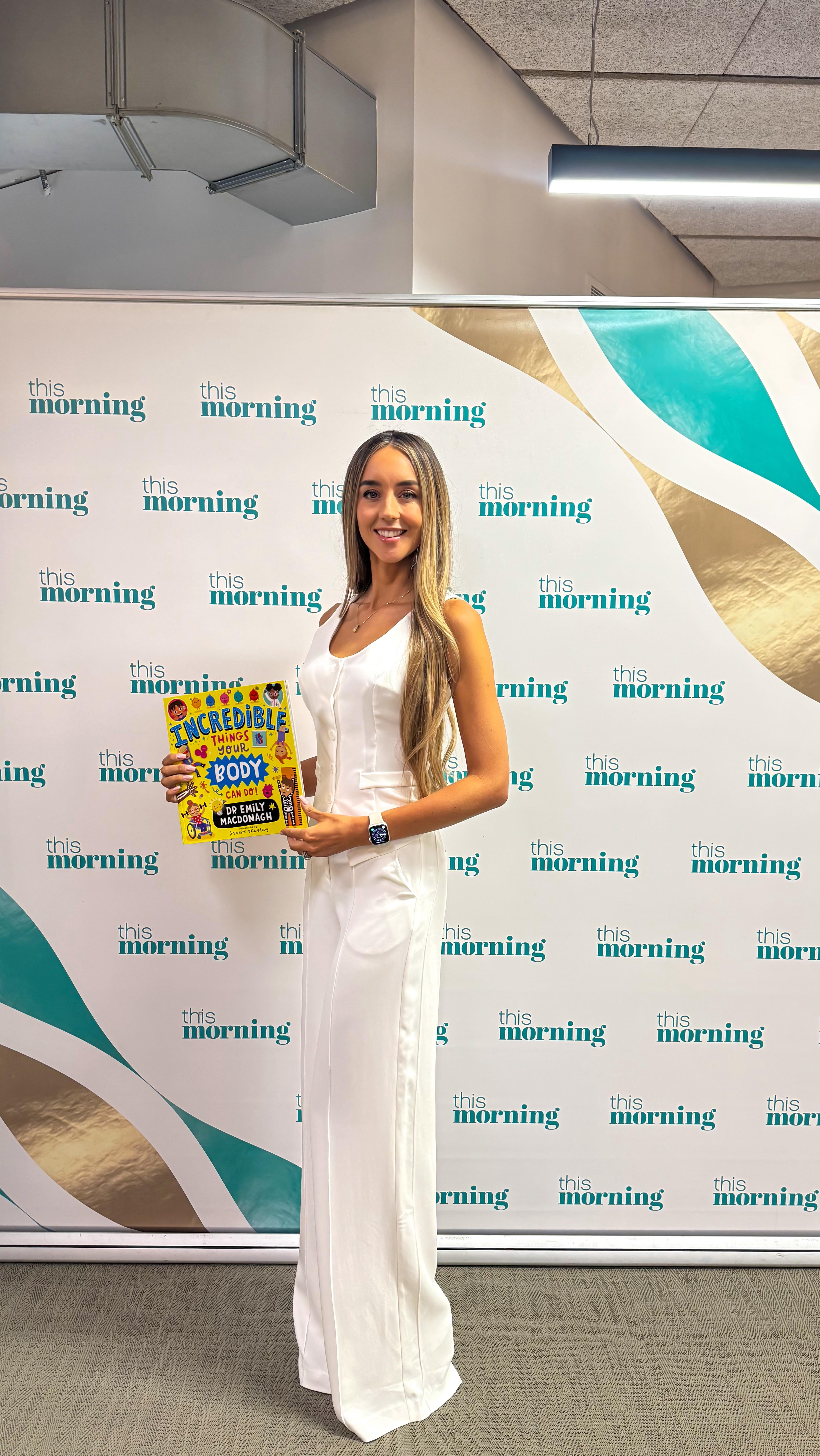 Instagram post by @dr_emily_official for Karen Millen. Caption reads: What a morning! From chatting on @thismorning....