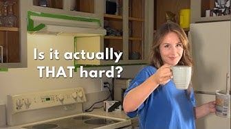 YouTube post by @flippedbyabby for SurfPrep sanding. Caption reads: I Painted My 90's Oak Cabinets | Kitchen Makeover.