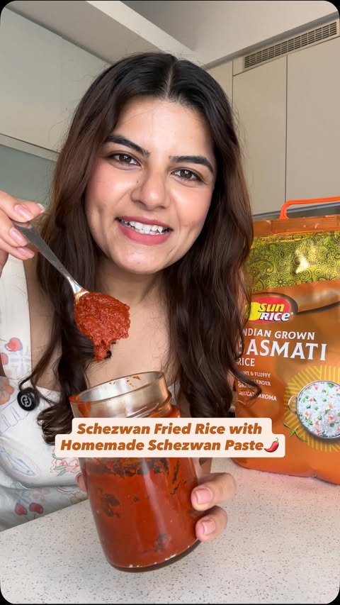 Instagram post by @cookinwithkt_ for SunRice. Caption reads: [...] Favourite 🍚🌶️ Made with aromatic @sunrice....