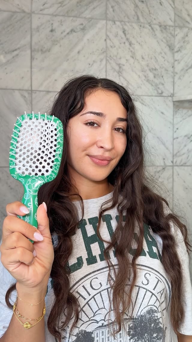 Instagram post by @laladoghmi for FHI Heat. Caption reads: [...] #worldcup themed #unbrush brushes from....