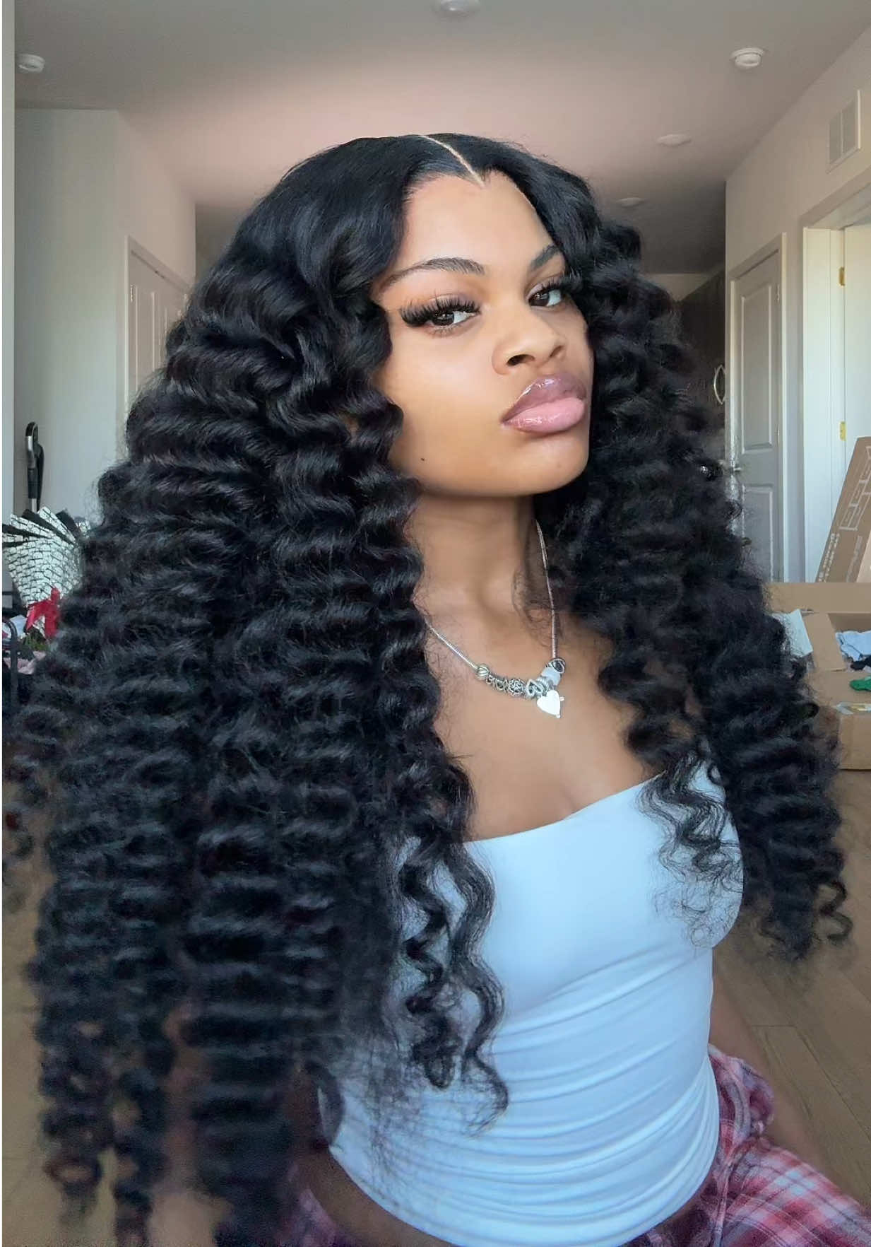 TikTok post by @misslonik for Sterly Hair Shop. Caption reads: Absolutely IN LOVEEE!!😍😍 This 7x6 Burmese curly....