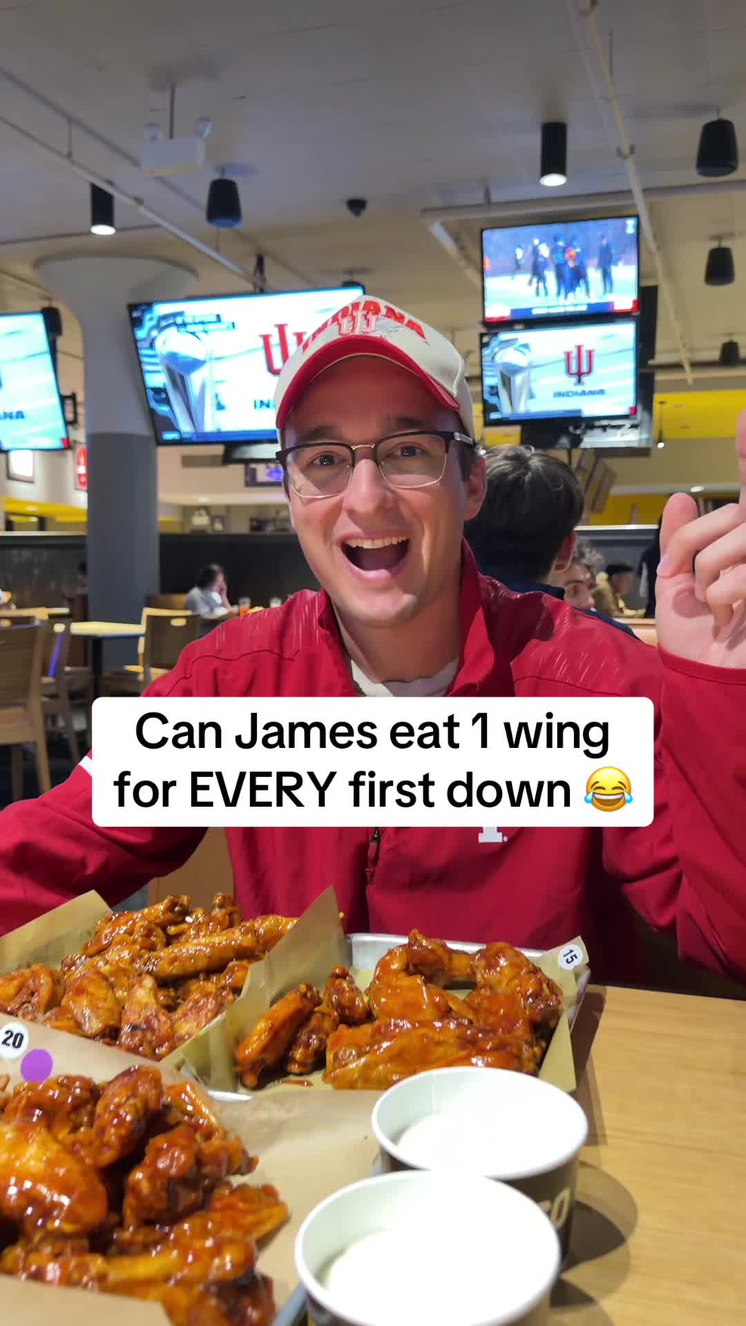 TikTok post by @handshakebets for Buffalo Wild Wings. Caption reads: Over/Under 42.5 Wings Tonight 😂 @Buffalo Wild....