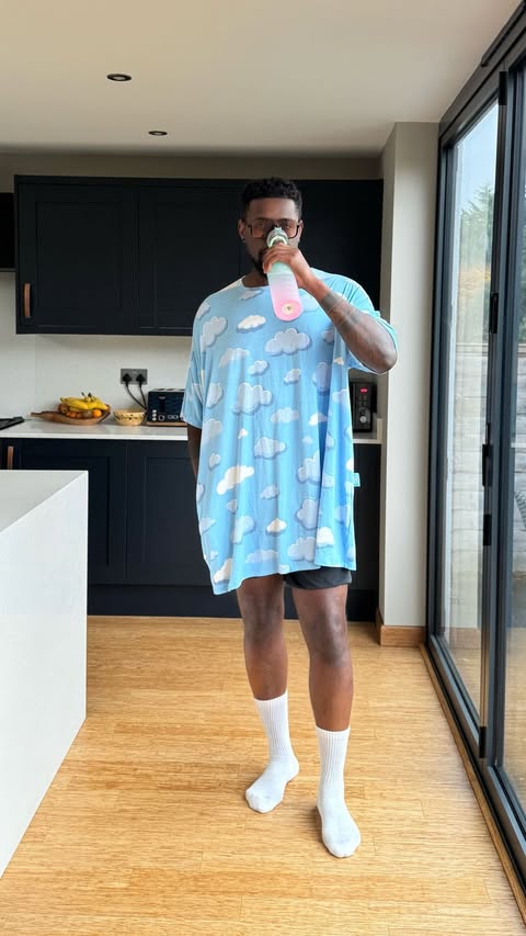 Instagram post by @alfredinho.carreira for The Oodie. Caption reads: Normalize wearing oversized sleep tees 24/7. 1....