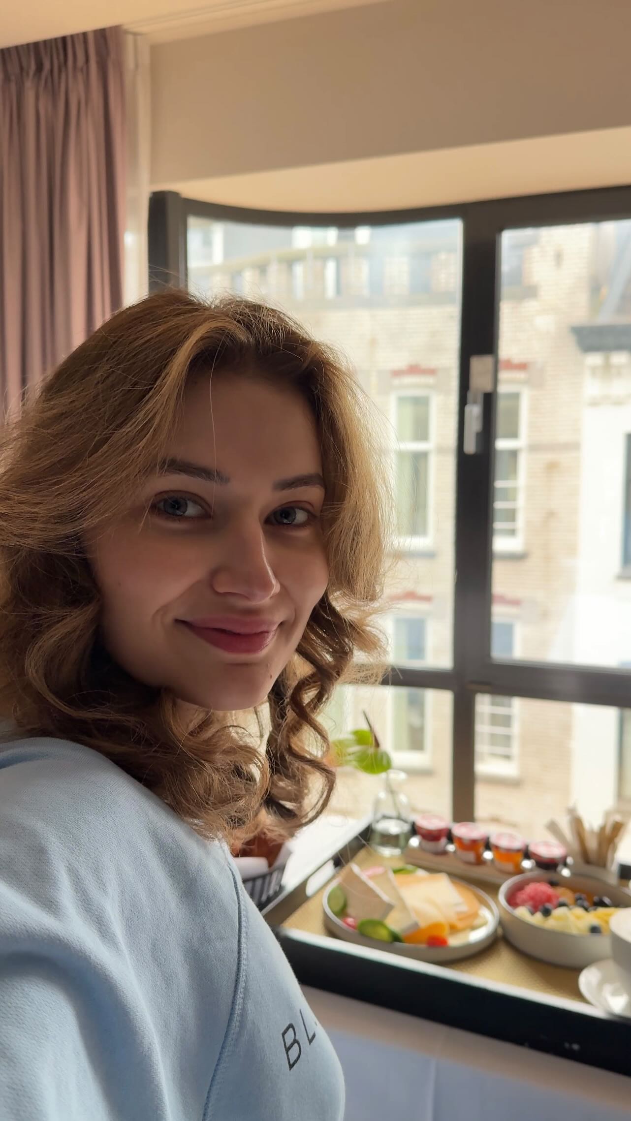 Instagram post by @sarahpalmyra for Bloomeffects. Caption reads: Fly with me to Amsterdam ✈️ thank you....