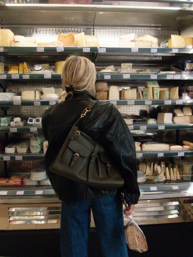 Instagram post by @lucywilliams02 for Mulberry. Caption reads: Ad - Enjoys cheese shopping and book browsing,....