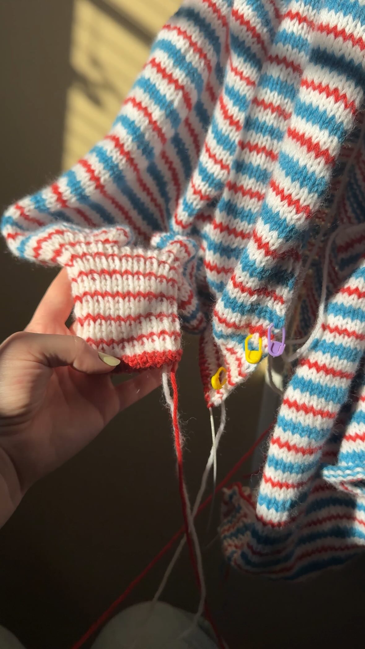 Instagram post by @knitsn.bits for Knit Picks. Caption reads: Update on my #LoupyStripeCardi for the....