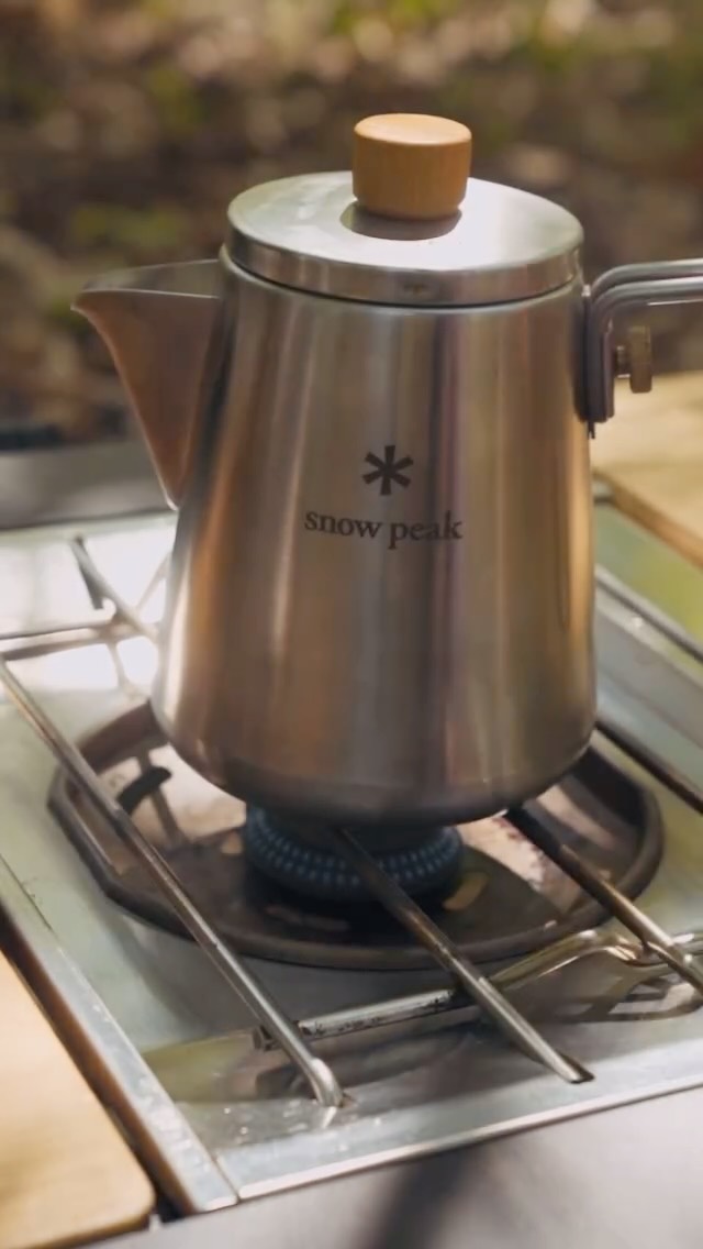 Instagram post by @lowkeyjonni for Snow Peak. Caption reads: A weekend coffee in the woods with @snowpeak_uk....