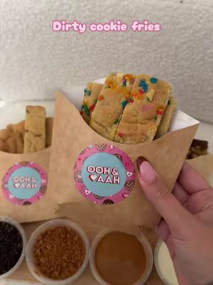 TikTok post by @sophiezoemain for Ooh & Aah. Caption reads: [...] #eating #oohandaahcookies #foodie @Ooh & Aah....