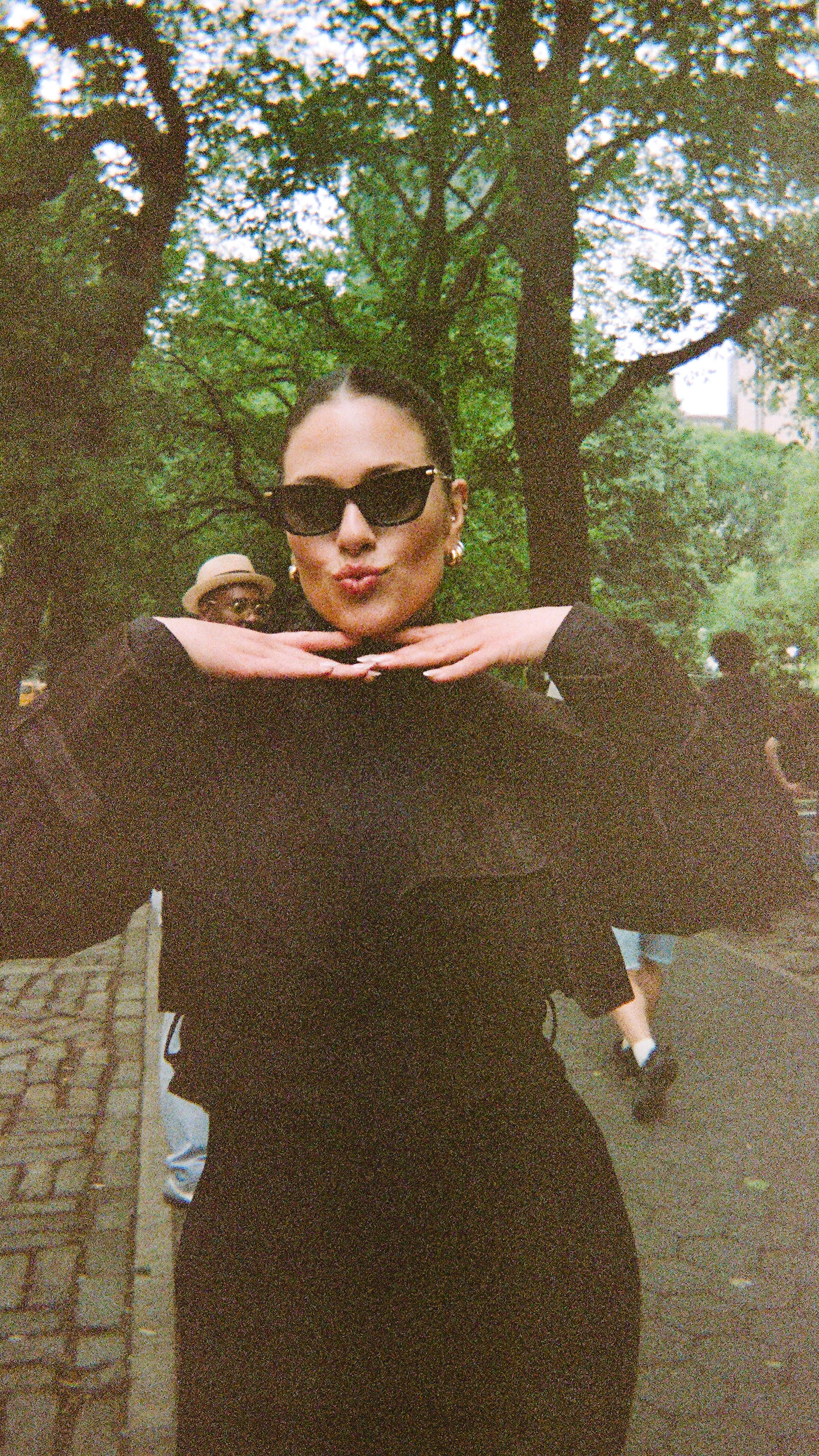 Instagram post by @ashleygraham for STUART WEITZMAN. Caption reads: more curves in luxury!! @stuartweitzman.