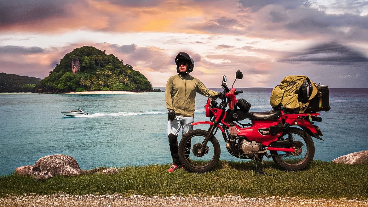 YouTube post by @PaddyDoyle. for SafetyWing. Caption reads: Riding 700km Searching For Paradise In Thailand....