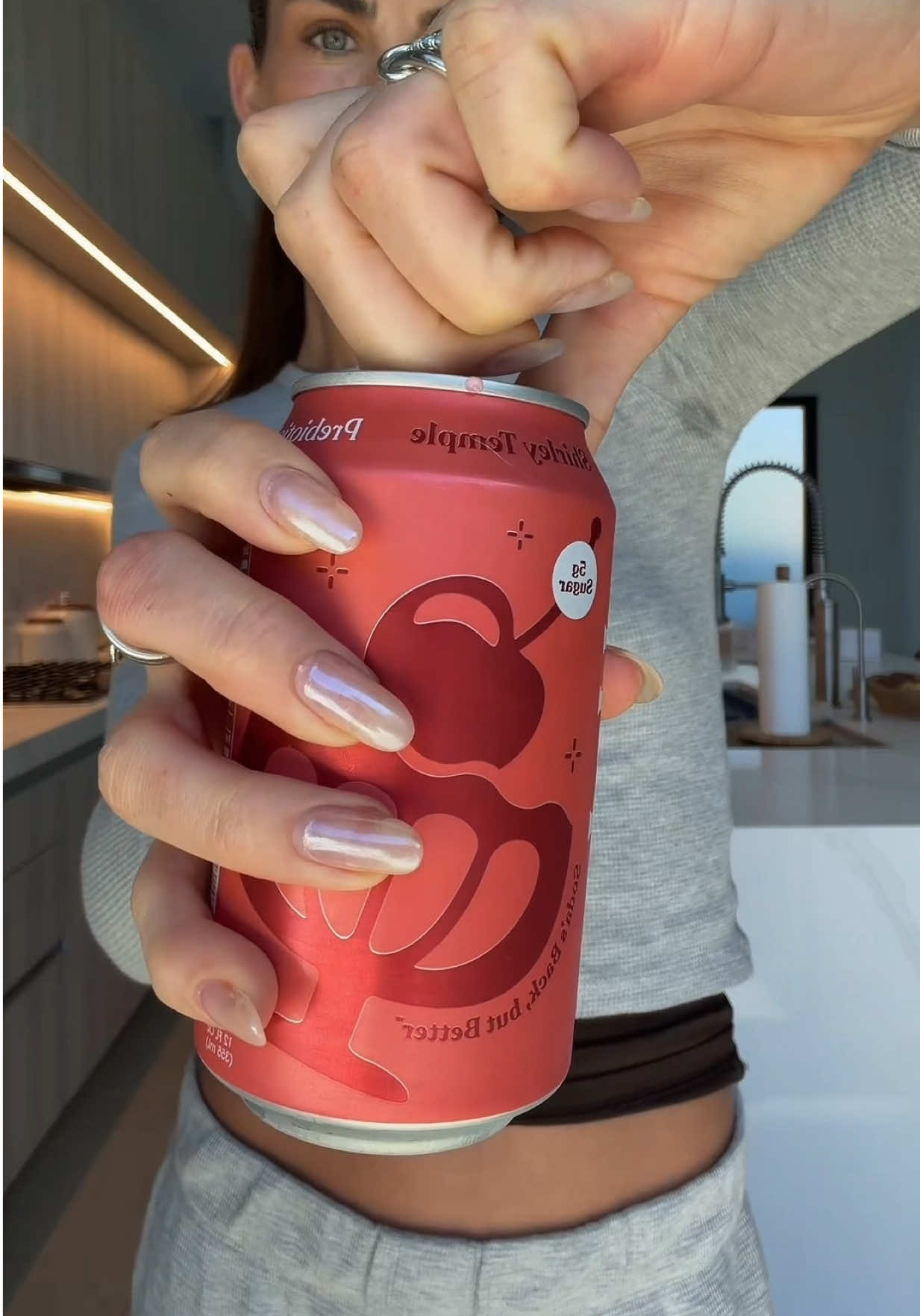 TikTok post by @paigelorenze for Poppi. Caption reads: [...] we really need to talk about this....