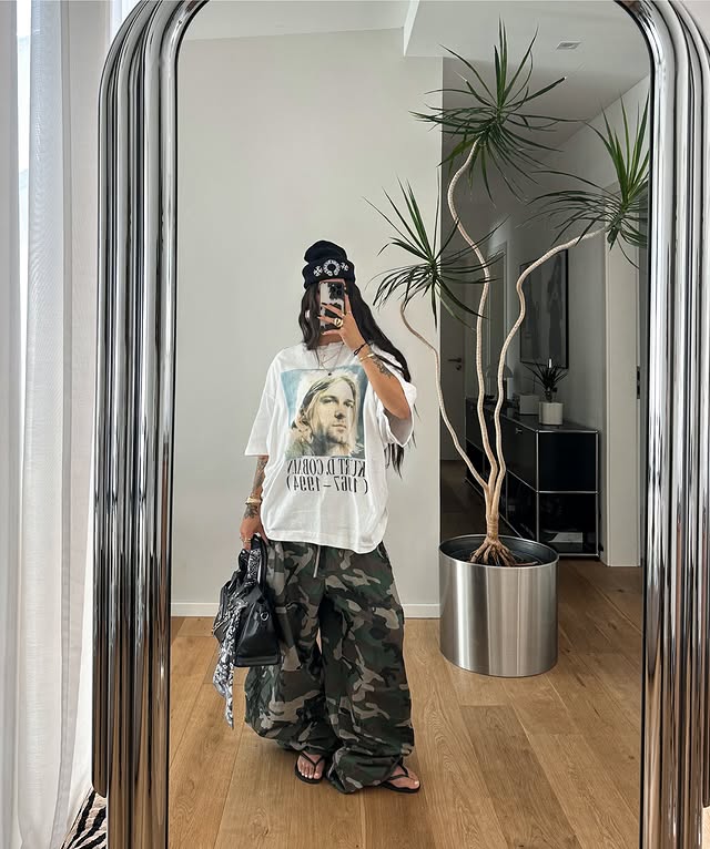 Instagram post by @blvckd0pe for boohooMAN. Caption reads: Camo > Pants @boohoomanofficial | ad [...].