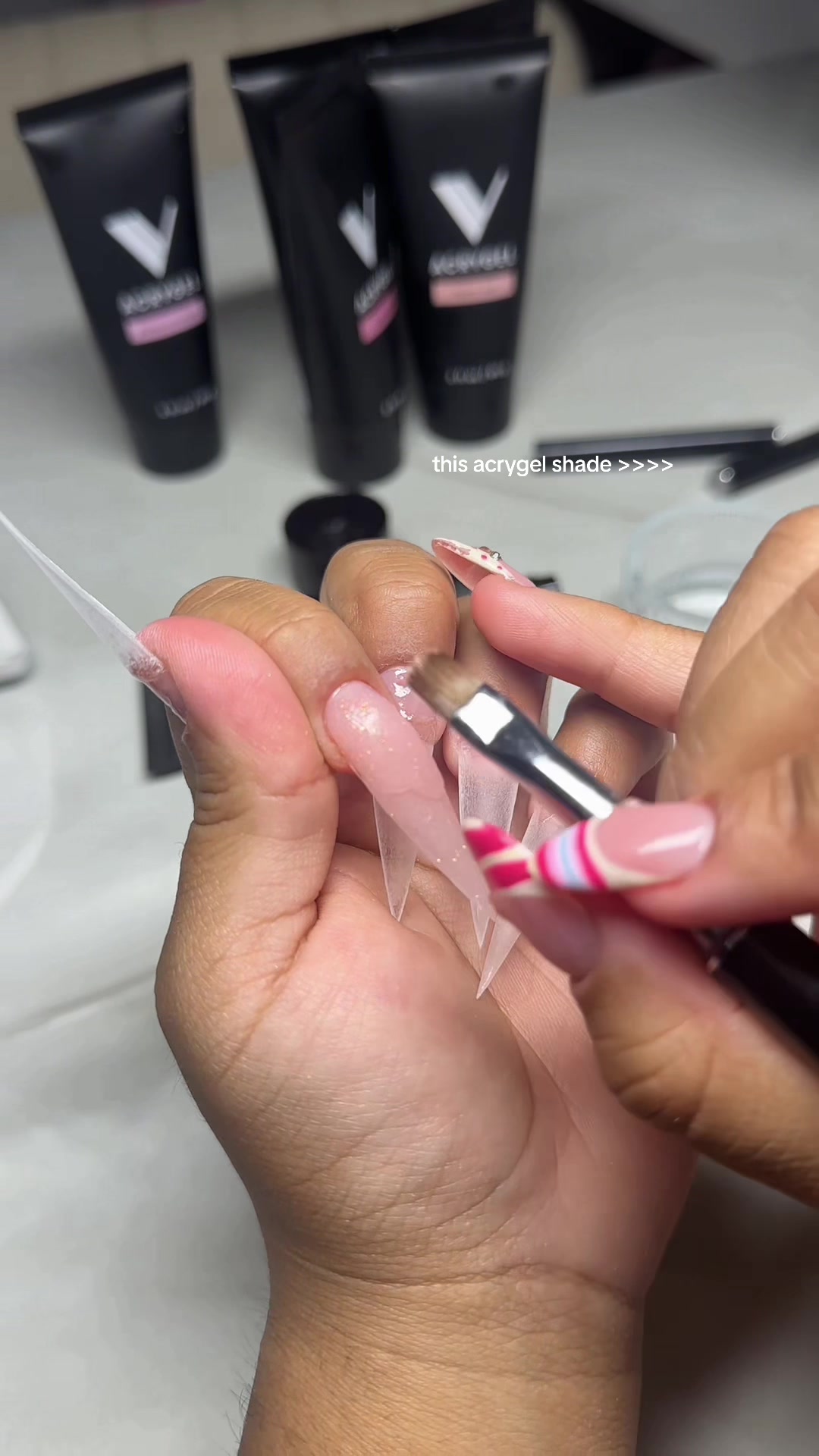 TikTok post by @nailsssbynancy for V Beauty Pure. Caption reads: satisfying acrygel application 🤤 @vbeautypure dc:....