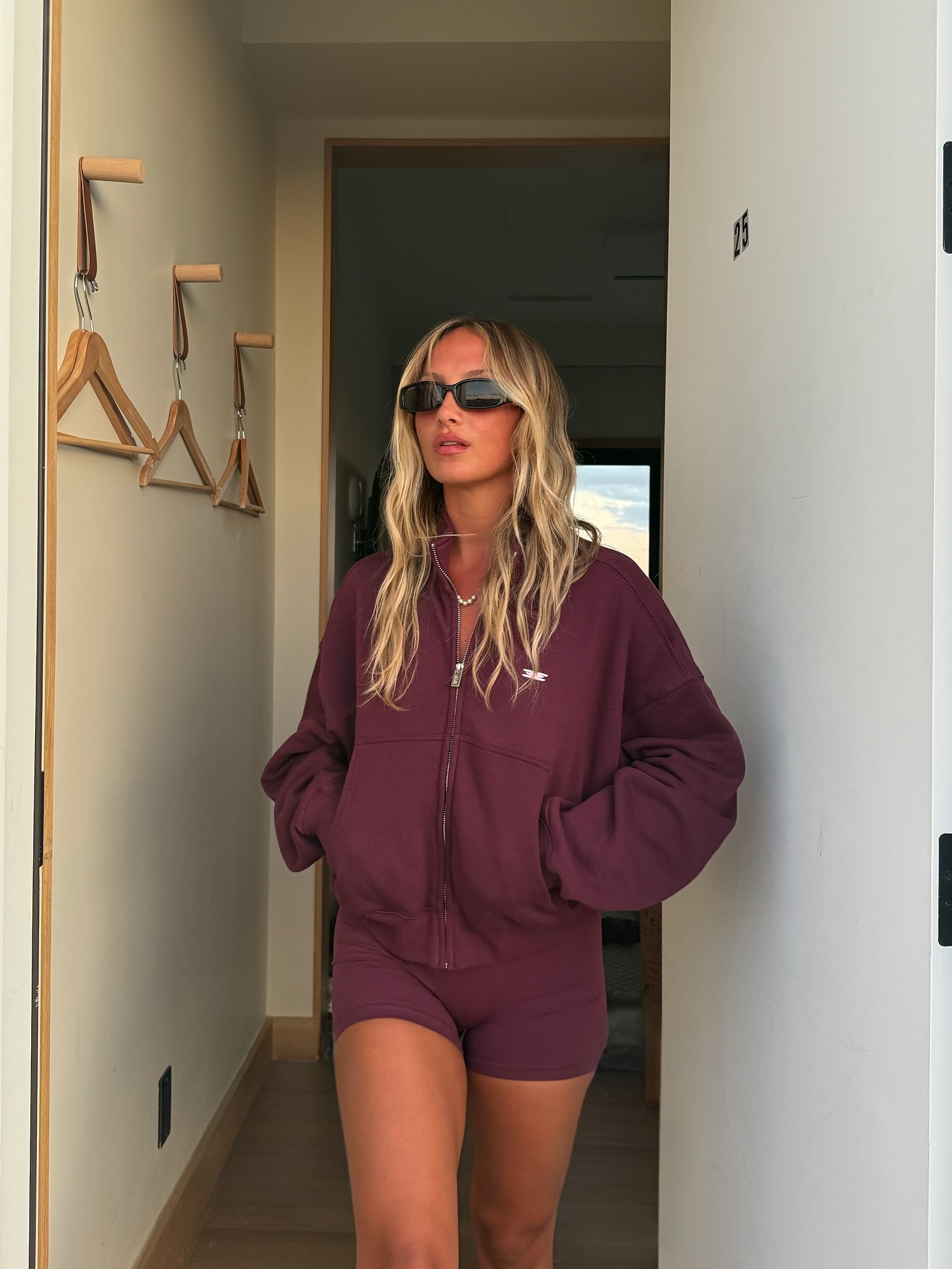 Instagram post by @brookemooney_ for Elite Eleven Sporting. Caption reads: always cozy in my @eliteelevensporting sets ✨....