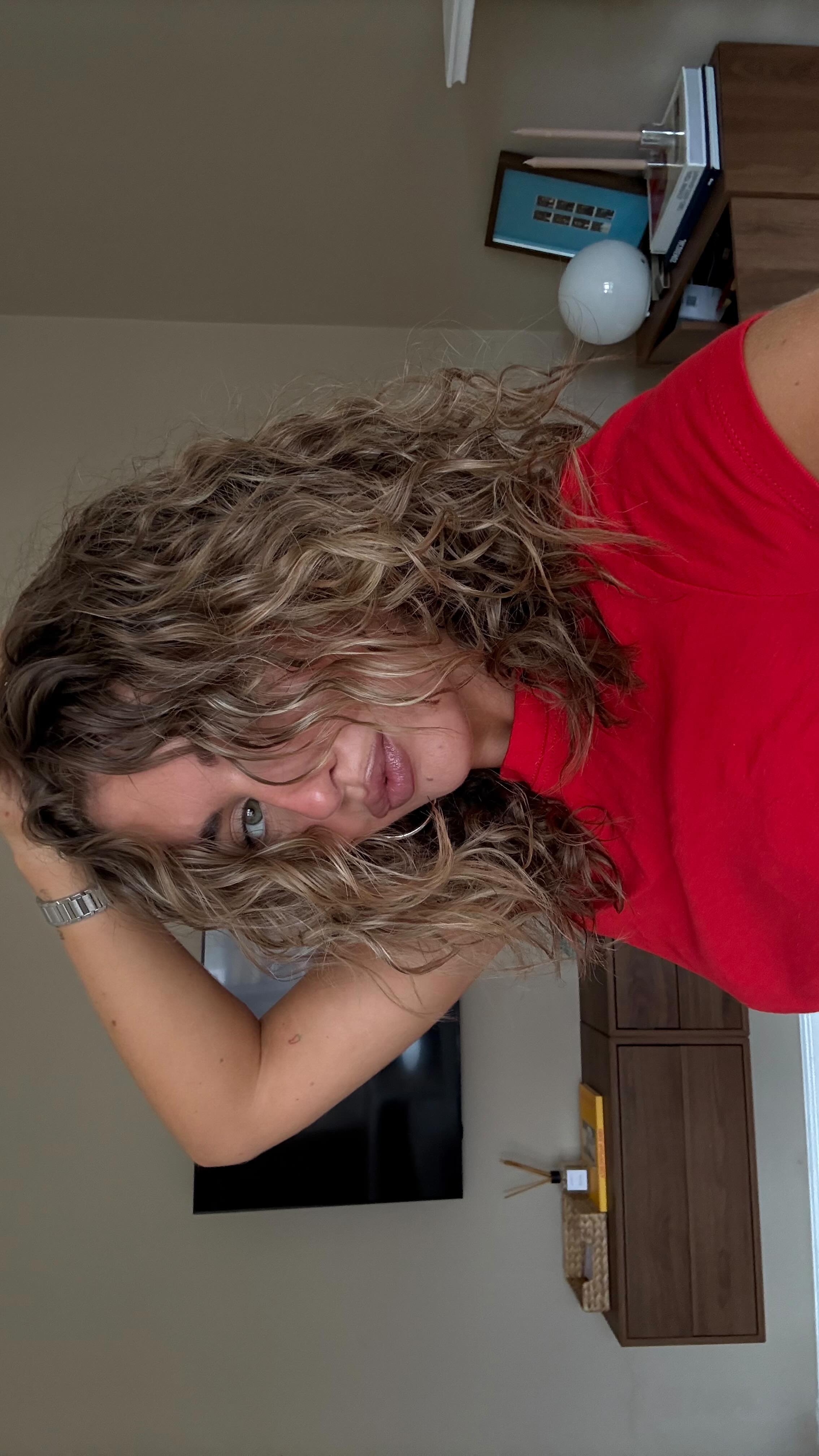 Instagram post by @molly.mcfarlane for UMBERTO GIANNINI. Caption reads: curly girl @umbertogiannini ad.