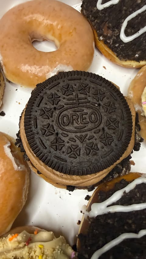 Instagram post by @markie_devo for Krispy Kreme Doughnuts. Caption reads: Krispy Kreme Oreo Collection!🍪 (Thanks....