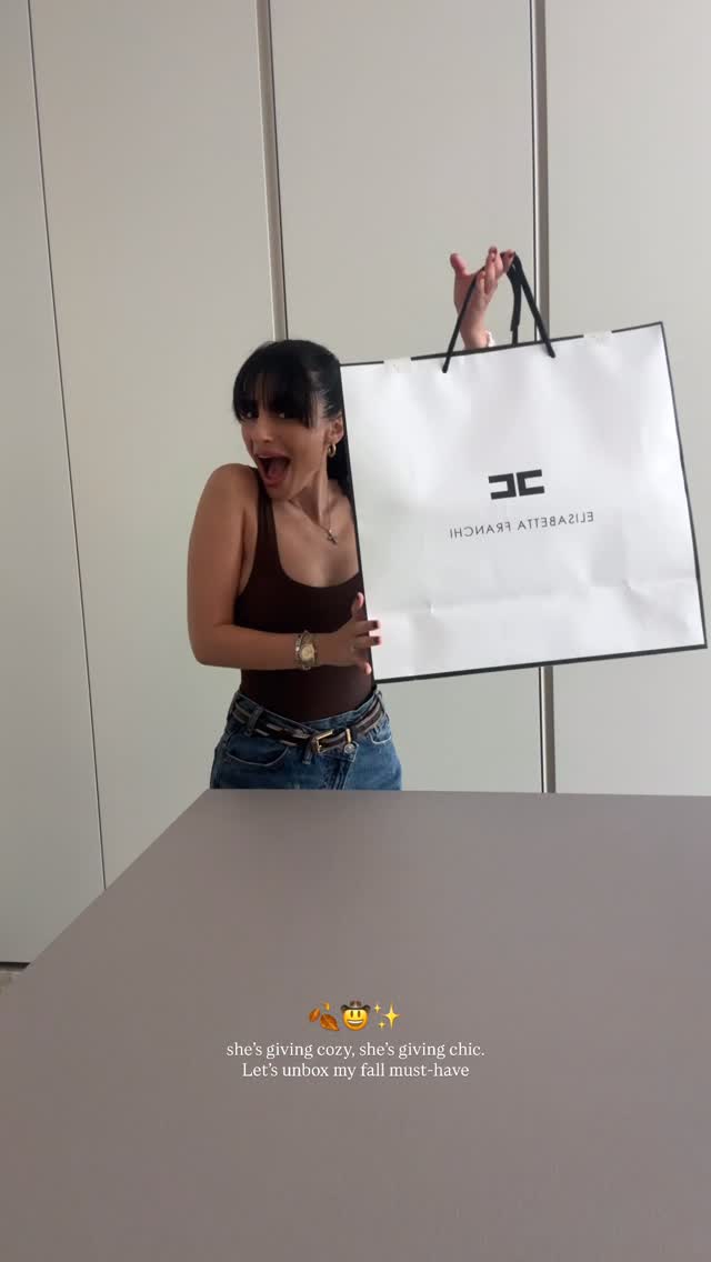 Instagram post by @dizzgroupmalta for Elisabetta Franchi. Caption reads: she’s giving cozy, she’s giving chic. Let’s unbox....