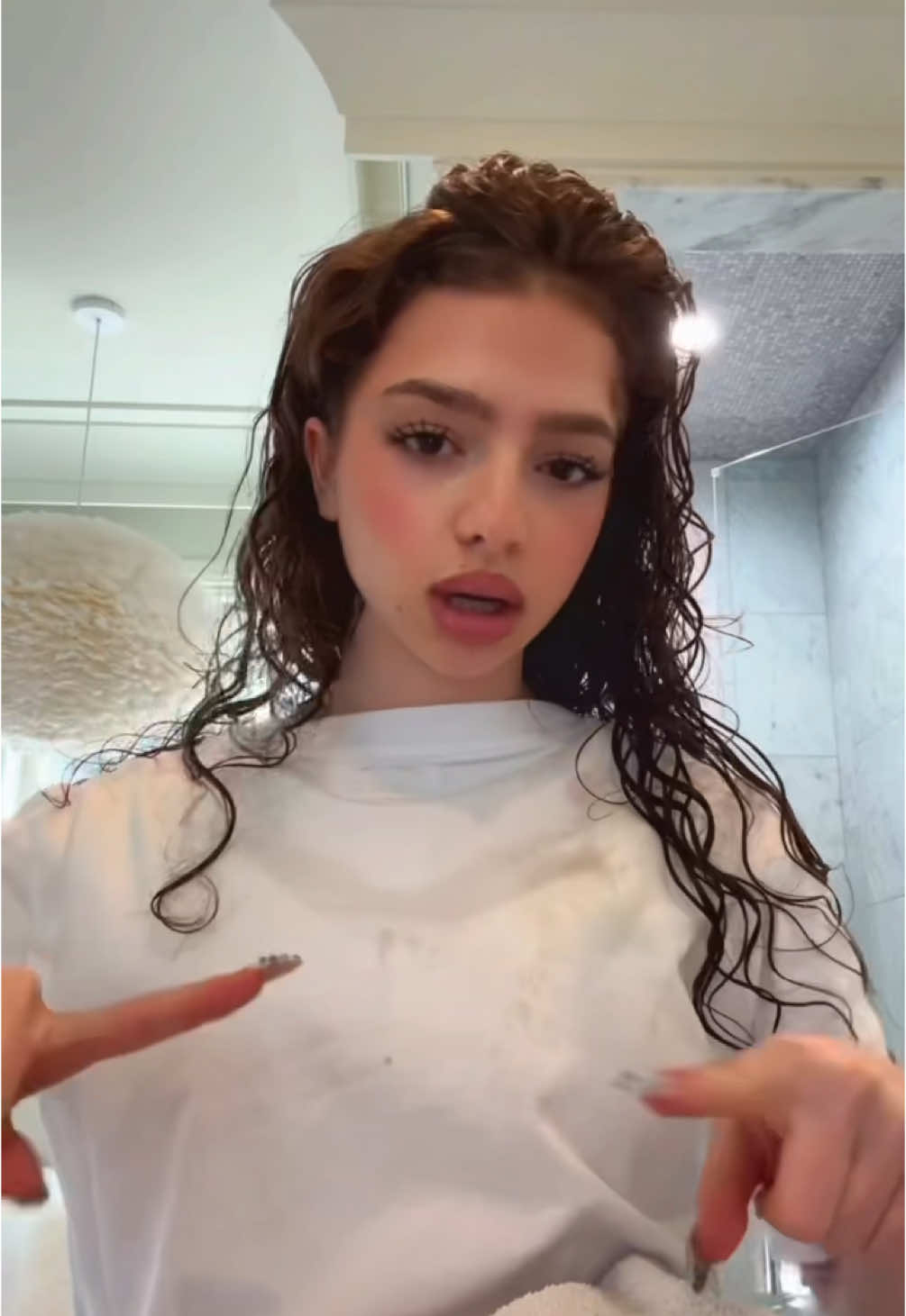 TikTok post by @demitrakalogeras for Paul Mitchell. Caption reads: Had to do my hair… @Paul Mitchell....