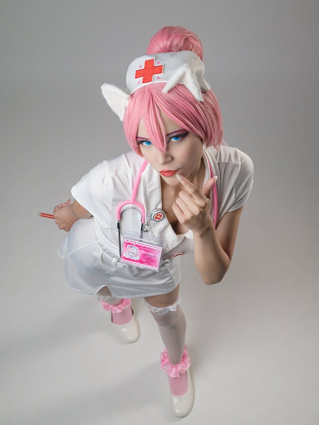 Instagram post by @the_best_of_cosplay.2 for CosPositive. Caption reads: - “ I’m Red Heart, I’ll be your nurse tonight “ 💖....