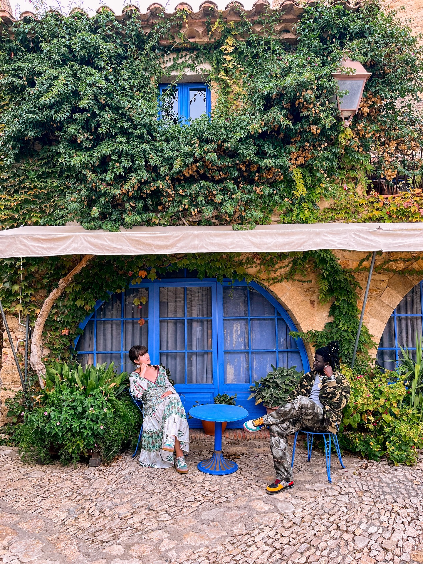 Instagram post by @agatedaydreamer for Girls LOVE Travel. Caption reads: Wandering through Peratallada feels like stepping....