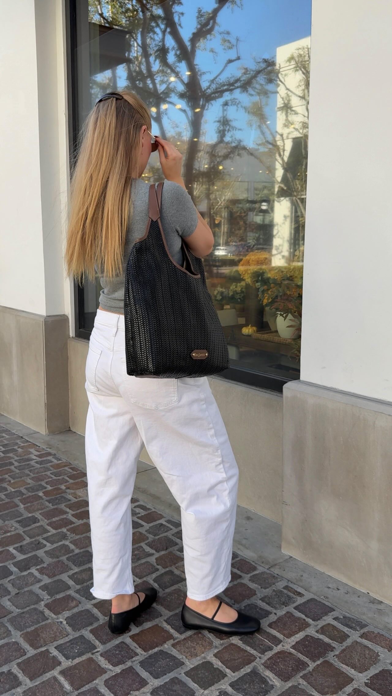 Instagram post by @helenelane_ for Eric Javits. Caption reads: Such a gorgeous bag ✨🤌🏼 @ericjavits 
Use code....