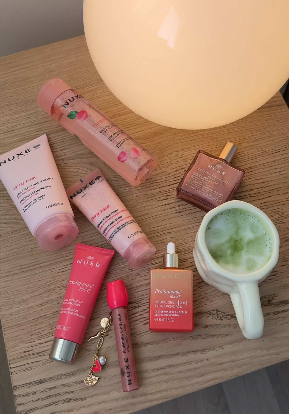 TikTok post by @nuage.dore for NUXE. Caption reads: Very Rose Routine @Nuxe 🌸🤍 • Gommage Eclat....