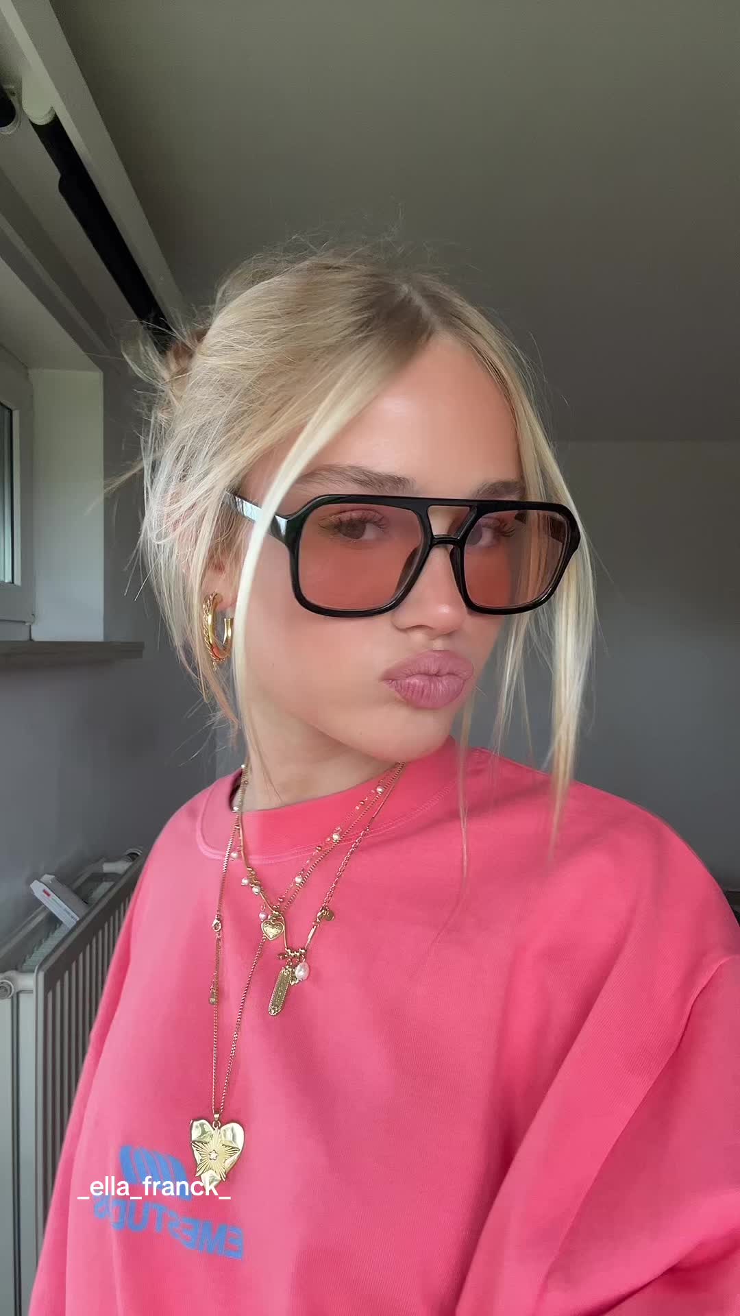 TikTok post by @_ella_franck_ for EME STUDIOS. Caption reads: Love this shirt @EME STUDIOS #AD #outfitinspo....