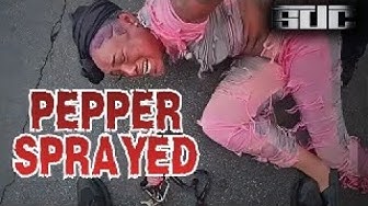 YouTube post by @Shanes_Dumb_Criminals for ExpressVPN. Caption reads: Cops Pepper Spray Woman Refusing to Get Out of Her....