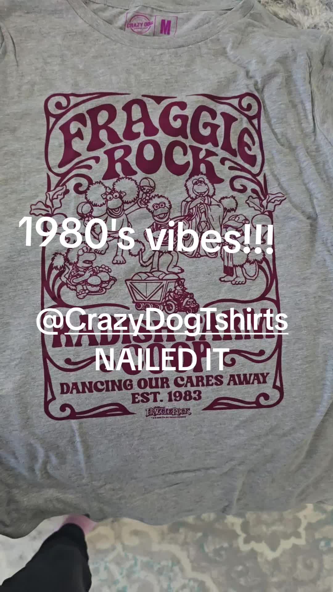 TikTok post by @wifeyrn for Crazy Dog TShirts. Caption reads: @Crazy Dog Tshirts #fragglerock #1980s....