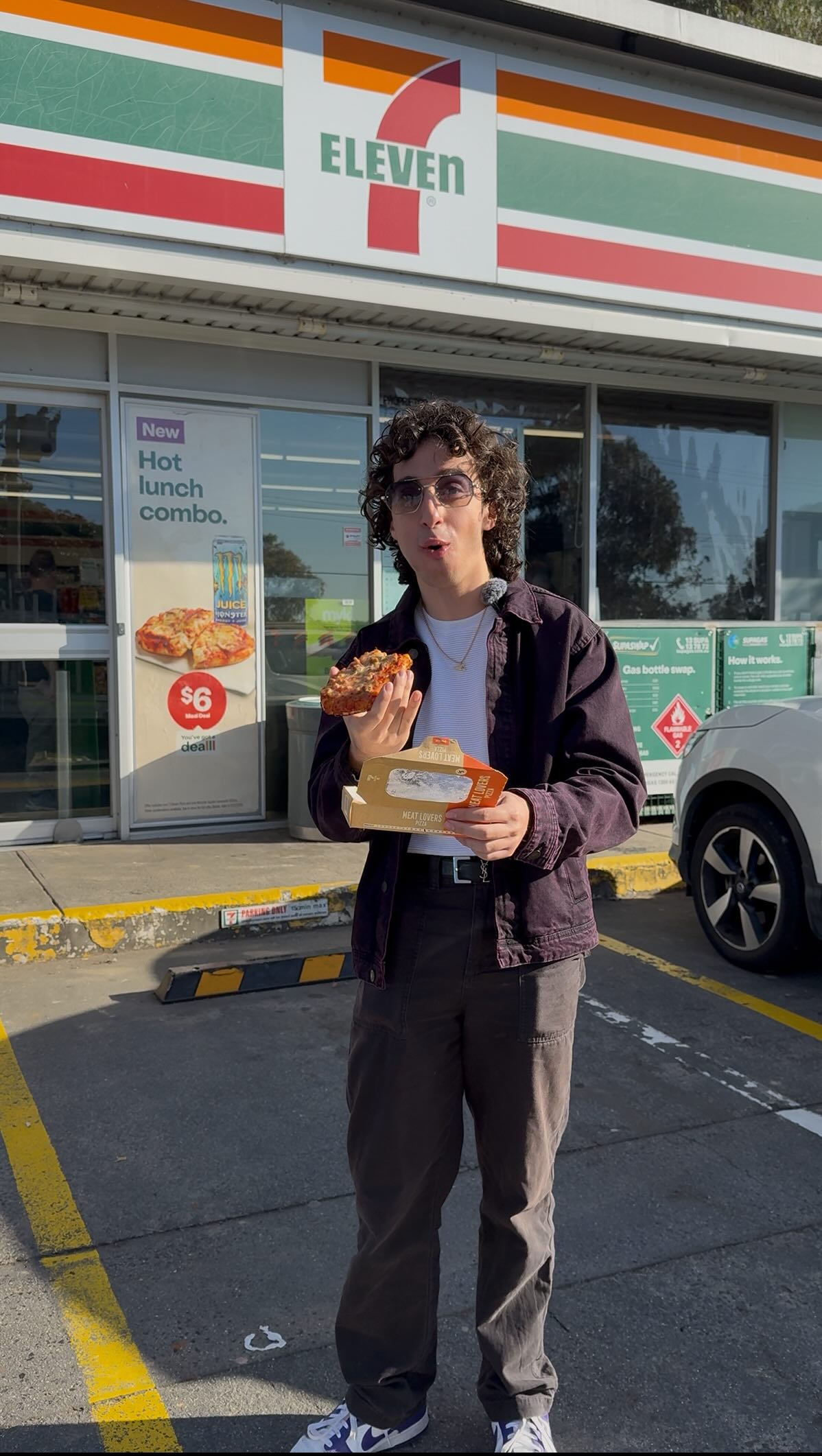 Instagram post by @masscorrente for 7-Eleven. Caption reads: PIZZA HAS ARRIVED AT @7elevenaus !!! Plot twist,....