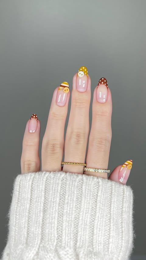Instagram post by @heajiheaji for Beetles Gel Polish. Caption reads: cutesie button nails🧶💛 using @beetlesgelpolish....
