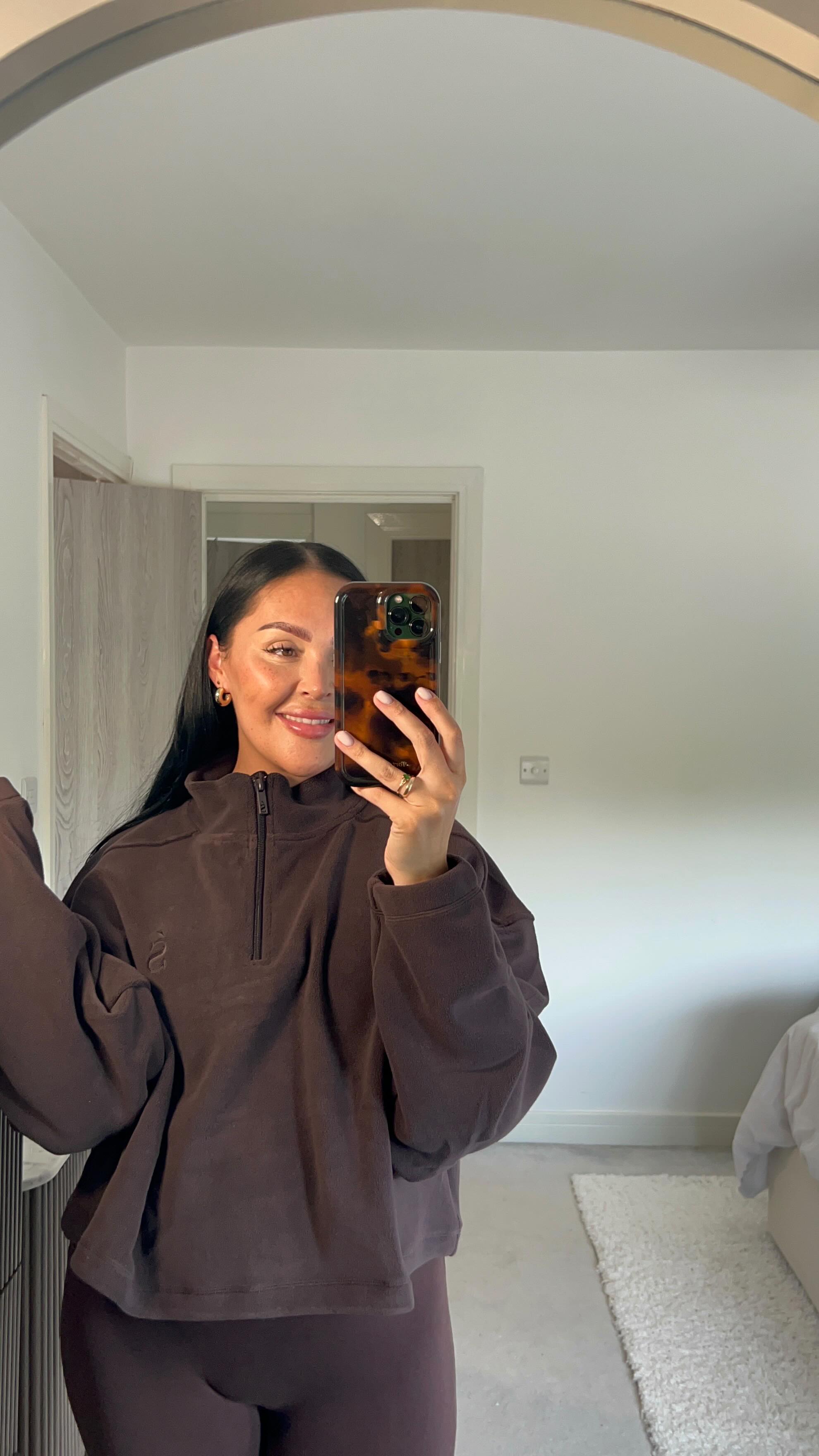 Instagram post by @aimeelouise0605 for Sunde Apparel. Caption reads: Obsessed with this collection @sundeapparel 🤎 ☕️....