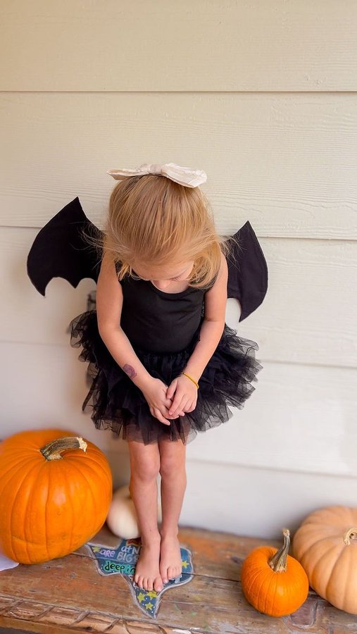 Instagram post by @idkivy for iloveplum. Caption reads: Bat wings with a @plumnyc tutu 🦇 easy last minute....