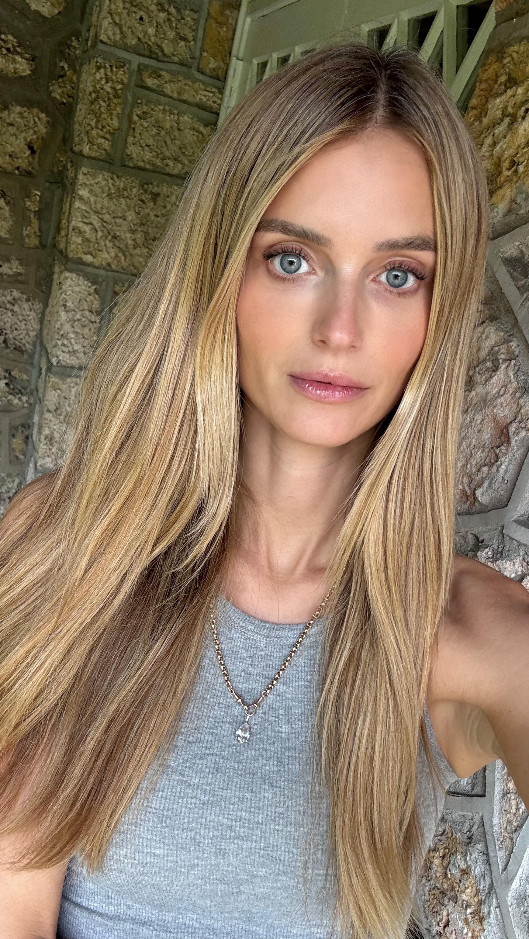 Instagram post by @katelove for Supergoop. Caption reads: OBSESSED with this skin GLOW..