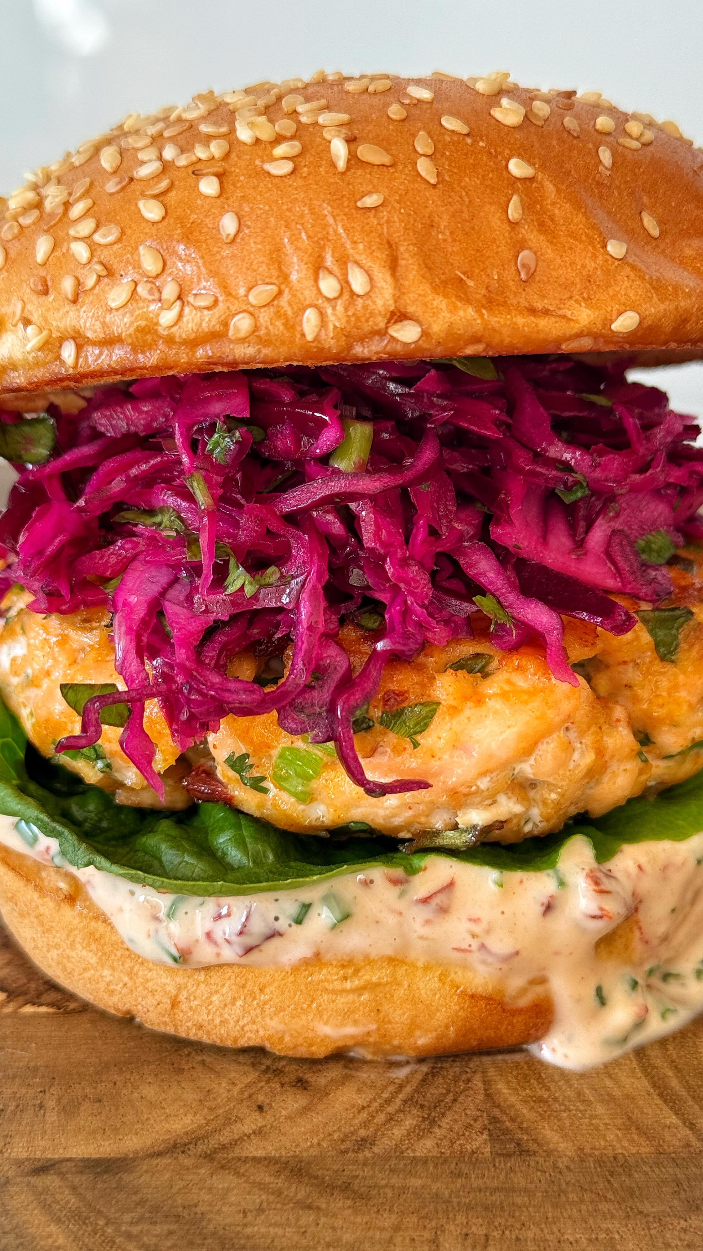 Instagram post by @medusa.eats for Buzzfeed. Caption reads: Chipotle Salmon Burger 🍔🐟 #chipotle #foodie....