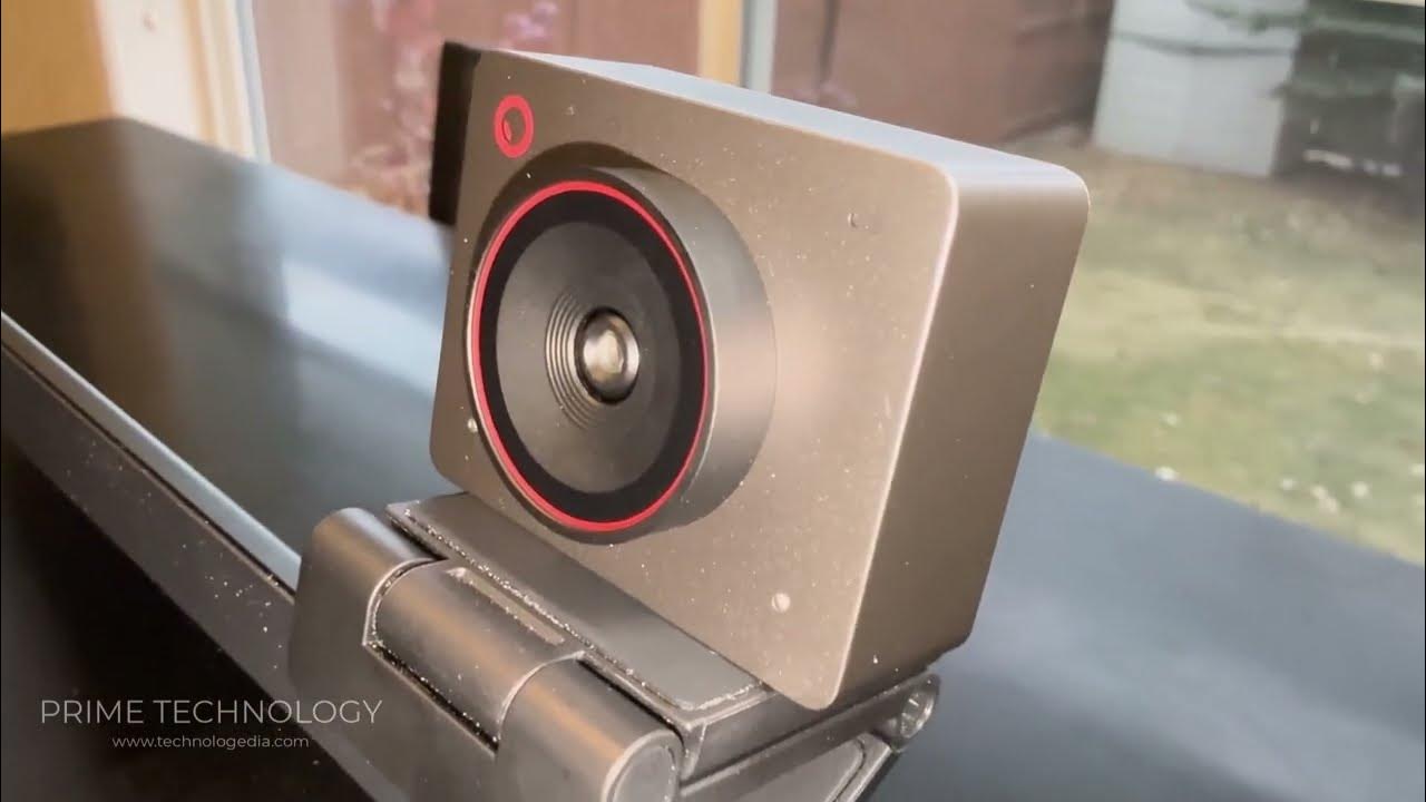 YouTube post by @primetechnologyhd for OBSBOT. Caption reads: OBSBOT Meet 2 4K Webcam with AI Framing & Auto....