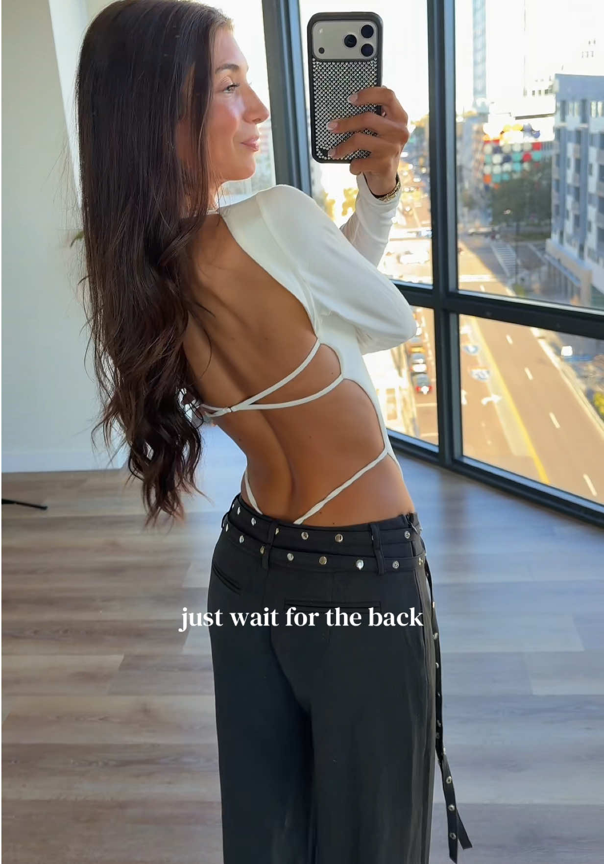 TikTok post by an influencer for Tiger Mist. Caption reads: @Tiger Mist backless bodysuits >> [...].