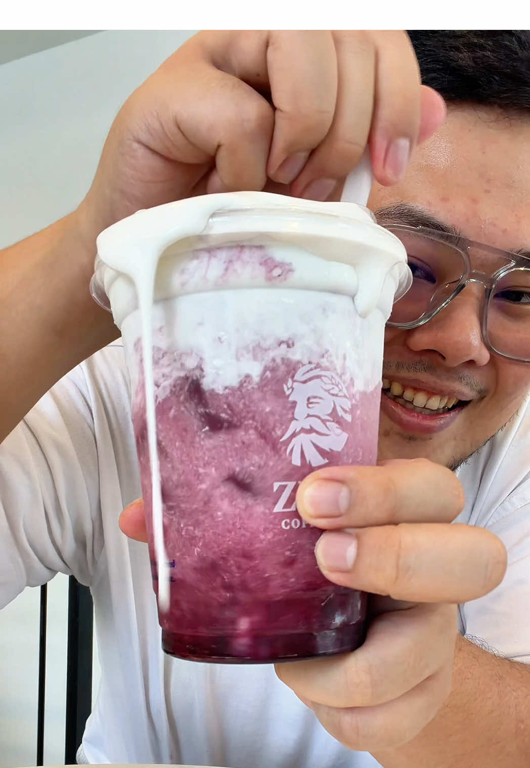TikTok post by @abewee1 for ZUS COFFEE. Caption reads: [...] Sekarang ada Grape series baru 🍇 @ZUS....